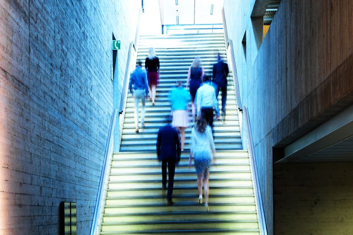TRUMPF employees walking upstairs