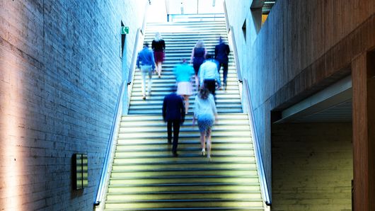TRUMPF employees walking upstairs