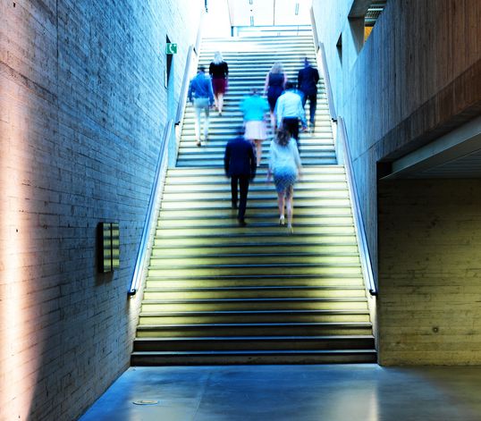 TRUMPF employees walking upstairs
