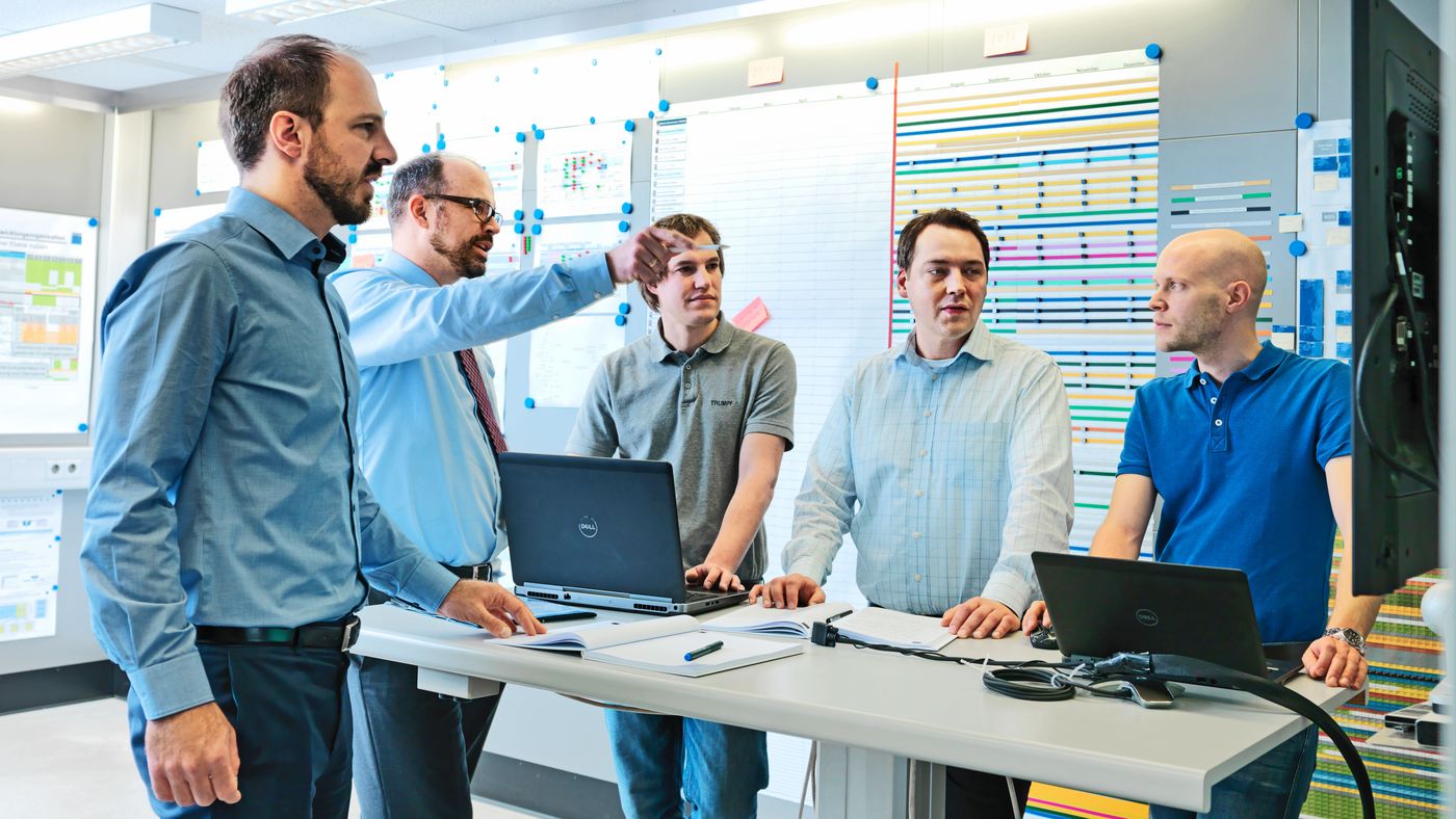 TRUMPF employees at the research and development department talking about a project
