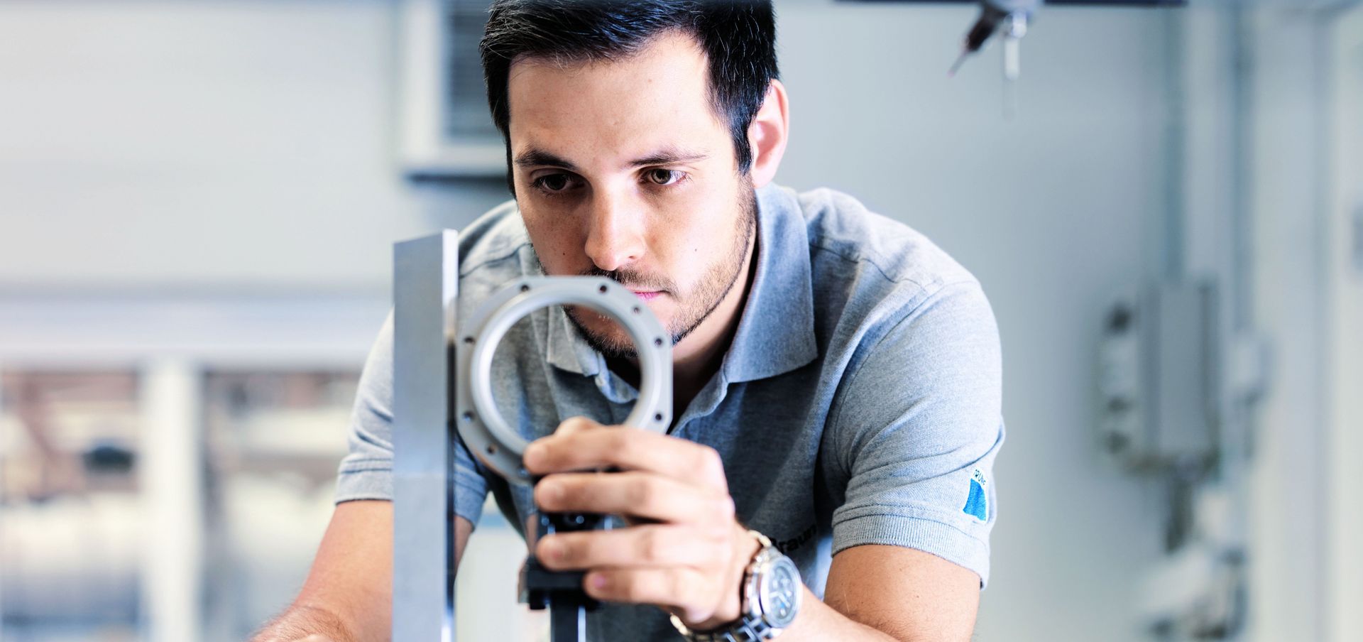 TRUMPF employee testing a component