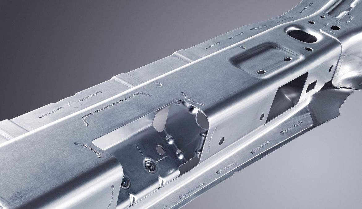 Scanner-welded rear center panel of an automobile chassis